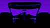 F1 24 – Screenshot, der das Heck eines Wagens vor einem violetten Hintergrund zeigt.