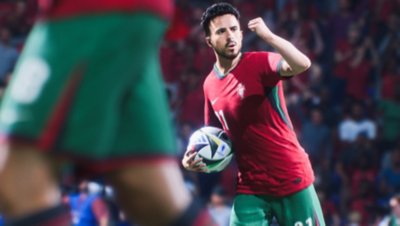 Captura de pantalla de UEFA EURO 2024 en EA Sports FC 24 que muestra un jugador portugués sosteniendo el balón y celebrando