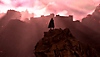 Een afbeelding van Frey die omhoogkijkt naar een kasteelachtig gebouw op een berg