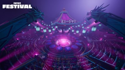 Fortnite Festival Season 7 screenshot showing a circular stage with the audience surrounding it, with two dragon pillars suspending strings of blue lanterns to the centre of the stage