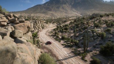 Snímka obrazovky z hry Forza Horizon 5 zobrazujúca niekoľko terénnych vozidiel pretekajúcich na prašnej ceste mexického vidieka.