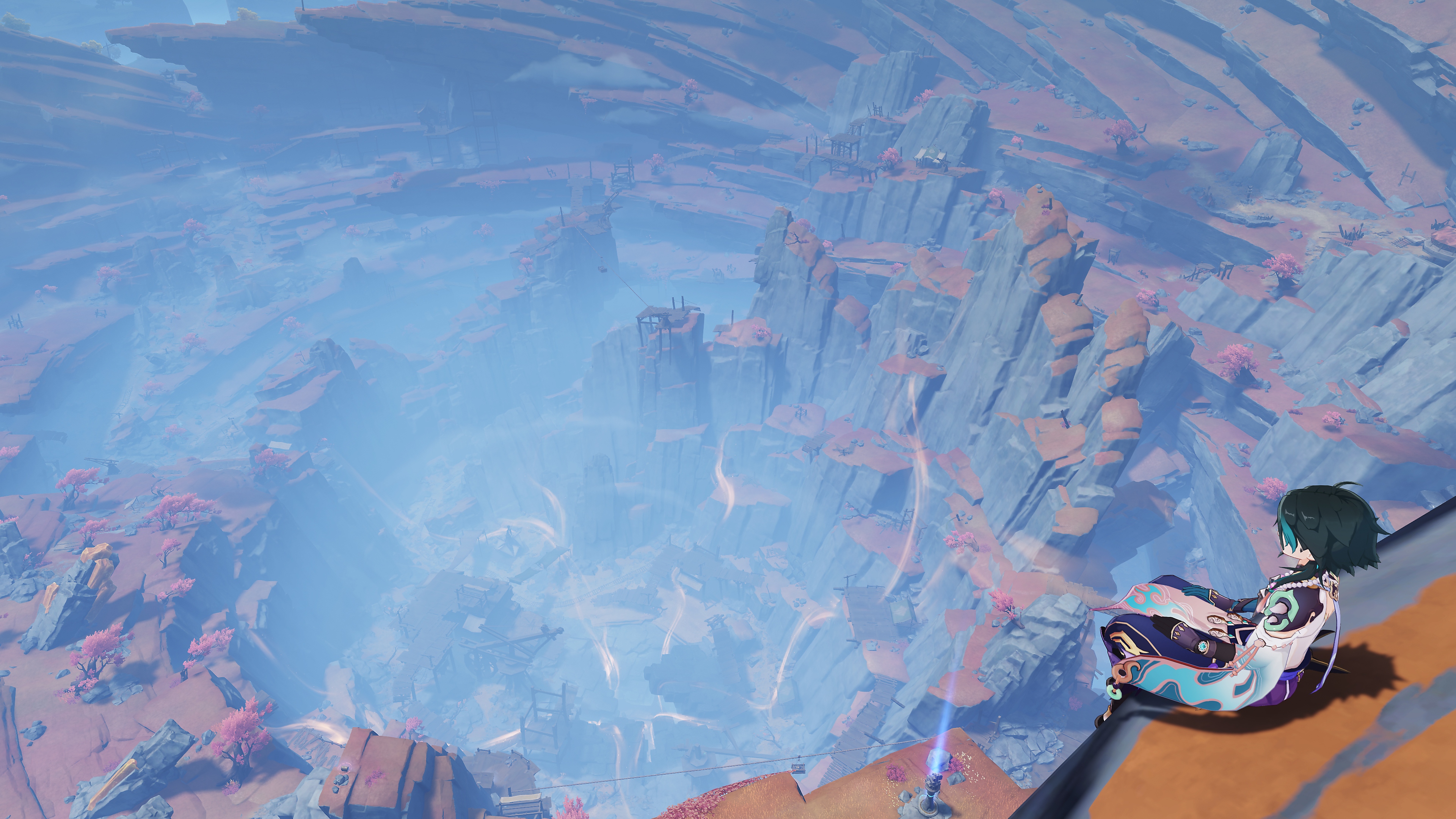 Genshin Impact: zrzut ekranu aktualizacji 2.7 przedstawiający postać siedzącą na skraju wysokiego klifu, patrzącą na krajobraz poniżej