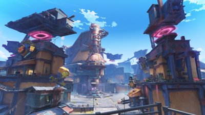Genshin Impact 6.0 screenshot showing an industrial town with structures reaching into the sky 