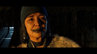 Cinematic screenshot from Ghost of Yōtei depiciting a woman with blue paint across her lips.