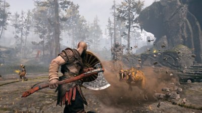God of War screenshot showing Kratos in combat with axe and shield