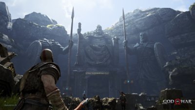 god of war pc screenshot showing Kratos looking up at a statue