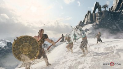 god of war pc screenshot showing Kratos and Atreus in combat against icy foes in a snowy scene