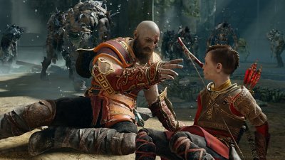 God of War screenshot showing Kratos and Atreus on the ground