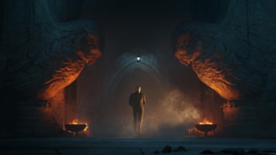 Gotham Knights screenshot showing a member of the Court of Owls standing between two giant stone owl statues