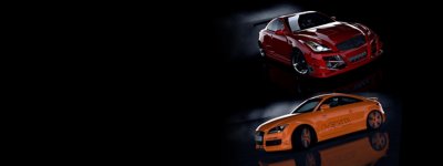 A dark scene showing a red and an orange sports car