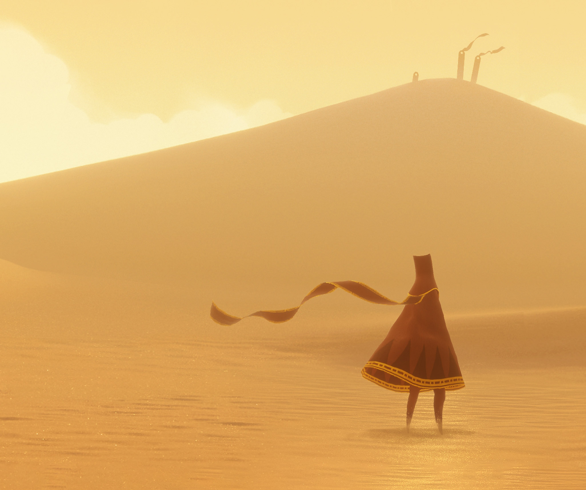 Journey-nøglegrafik med hovedfiguren "The Traveller" i en vidtstrakt, solbeskinnet ørken.