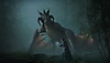 Hogwarts Legacy – snímka obrazovky zobrazujúca študenta stojaceho pred drakom