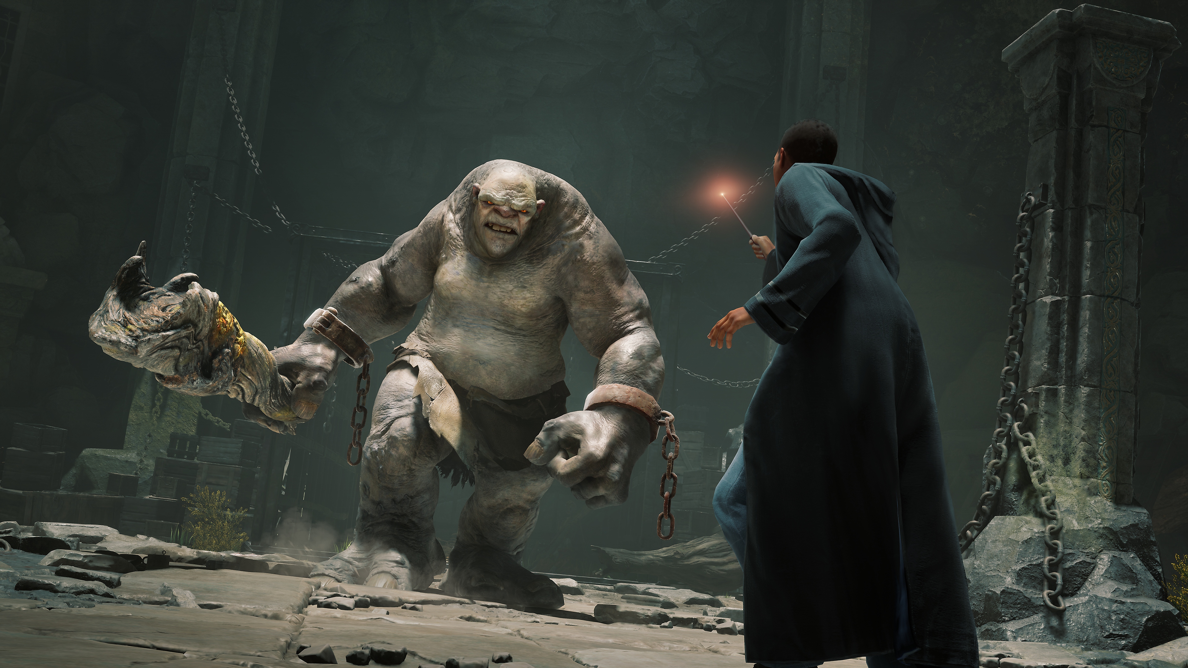 Snimka iz igre Hogwarts Legacy koja prikazuje trola koji trči prema učeniku