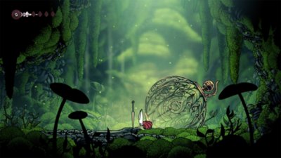 Gameplay screenshot from Hollow Knight: Silksong featuring Hornet inspecting the floor of a mossy cave.