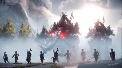 Ankündigungs-Screenshot von Horizon Forbidden West, der eine Maschine und Krieger zeigt.