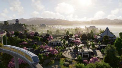 Jurassic World Evolution 3 - screenshot met een bovenaanzicht van een park met een monorail op de voorgrond