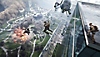 Battlefield 2042 screenshot showing a specialists jumping off the roof of a tall building as a helicopter flies towards them