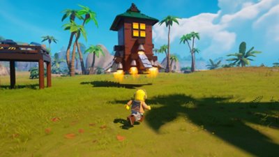 Captura de pantalla de Lego Fortnite que muestra un personaje de minifigura de LEGO que corre hacia una torre