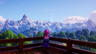Lego Fortnite screenshot showing a LEGO Minifigure character looking out over a mountainous landscape