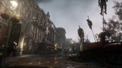 Lies of P screenshot showing a street lined with spike-impaled puppets