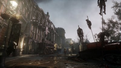 Captura de pantalla de Lies of P que muestra una calle llena de marionetas empaladas en estacas