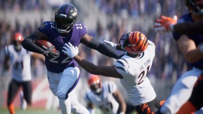 Madden NFL 25 screenshot showing a player holding off an opponent