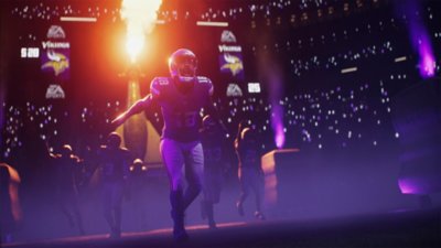 لقطة شاشة من لعبة Madden NFL 26 تظهر لاعبين يدخلون إلى الملعب في مباراة ليلية