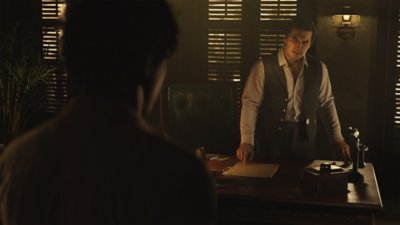 Mafia: The Old Country screenshot showing an angry looking man standing behind a desk