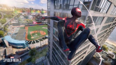 Marvel's Spider-Man 2 for PC screenshot showing Miles near a sports stadium