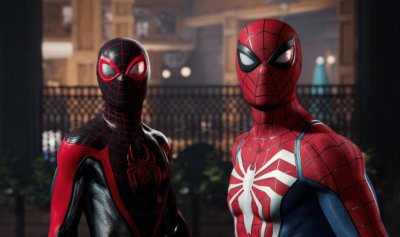 Peter Parker and Miles Morales stand in a park and look into the distance.