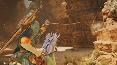 Monster Hunter Wilds screenshot showing a hunter using a Slinger to grab supplies from a distance.