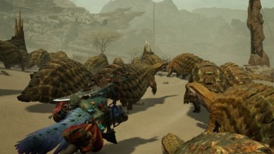 Monster Hunter Wilds screenshot showing a hunter riding their mount through a crowd of docile creatures in a desert environment.