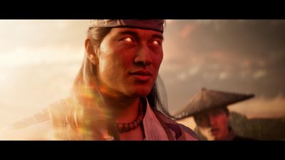 Captura de ecrã do Mortal Kombat 1 que mostra o Deus do Fogo Liu Kang com os olhos a brilhar