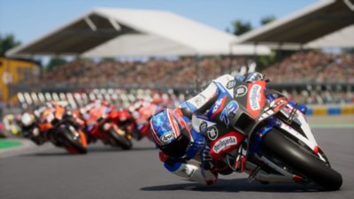 MotoGP 25 screenshot showing racers leaning into a corner
