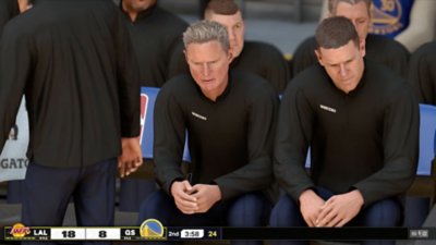 Captura de pantalla de NBA 2K25 que muestra a dos miembros del personal del equipo sentados en el banquillo