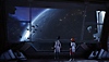 《新邊緣禁地傳說》螢幕截圖，呈現安努和另一名阿特拉斯員工從軌道航天器窗口觀察接近星球的飛船