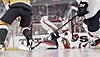 Capture d'écran de NHL 24 montrant un gardien de but plongeant de façon spectaculaire pour arrêter un tir