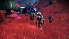 No Man's Sky screenshot showing a character in a red field with a hexagonal base