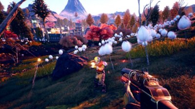 Captura de pantalla de The Outer Worlds que muestra a un jugador apuntando con el arma hacia un enemigo en un campo repleto de grandes plantas de color blanco.