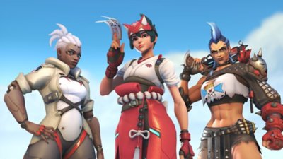 Arte promocional de Overwatch 2 que muestra a tres personaje con los que puedes jugar