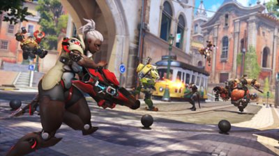 Overwatch 2 screenshot of characters fighting on cobblestone streets.