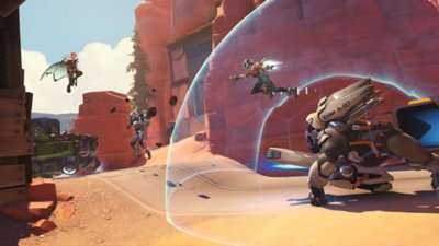 Overwatch 2 screenshot showing heroes defending the moving payload
