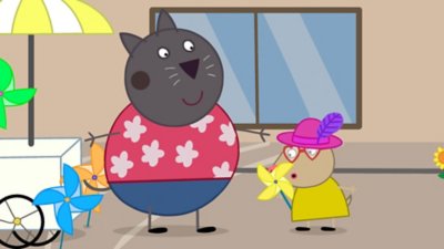 Captura de pantalla de Peppa Pig: World Adventures en la que se ve a dos personajes junto a un carrito que vende molinetes