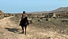 《Red Dead Redemption》螢幕截圖，呈現約翰·瑪斯頓騎乘馬匹