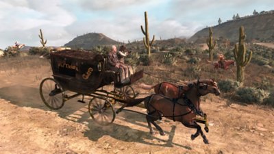 Red Dead Redemption – zrzut ekranu przedstawiający Johna Marstona jadącego na koniu oraz wóz