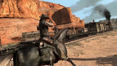 Red Dead Redemption screenshot showing John Marston riding a horse alongside a train