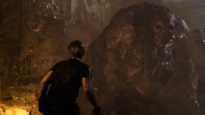 Captura de pantalla de Resident Evil 4 que muestra a Leon Kennedy topándose con El Gigante.