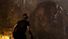 Resident Evil 4-screenshot van Leon Kennedy en een El Gigante.