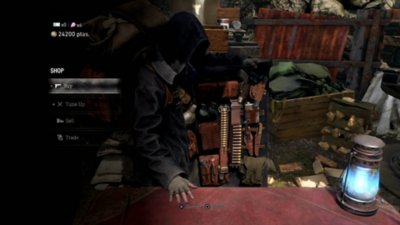Resident Evil 4 – kuvakaappaus Kauppiaasta myymässä tuotteitaan.