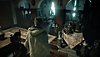 Resident Evil Village screenshot showing a third-person view of Ethan Winters in a room with dolls